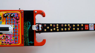 Speak 'n Spell Mates With Rock Band Guitar